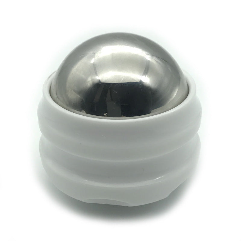 Silver metal massage ball with white rubber base designed for muscle pain relief and stress reduction.